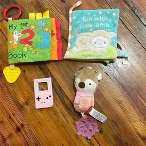 Lot of baby toys, teether, and books